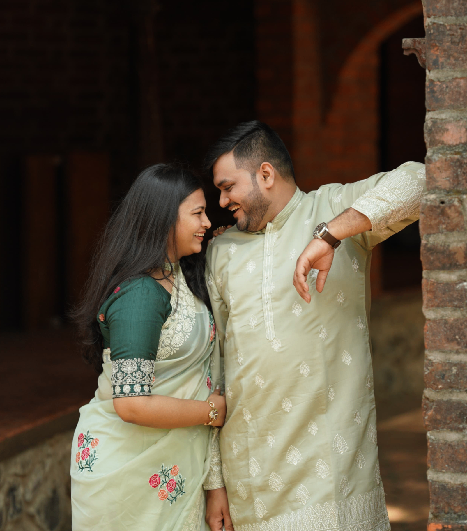 Saloni and Dharshan smiling together in traditional outfits
