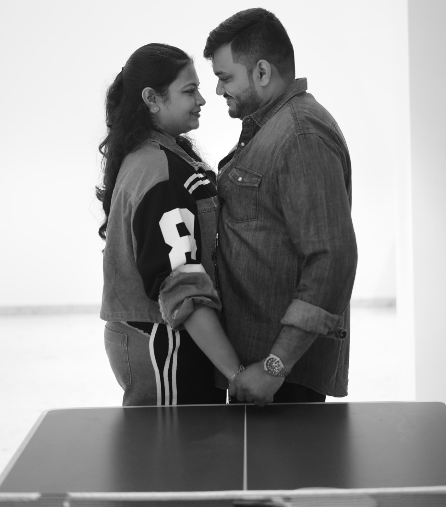 Black and white portrait of Saloni and Dharshan holding hands